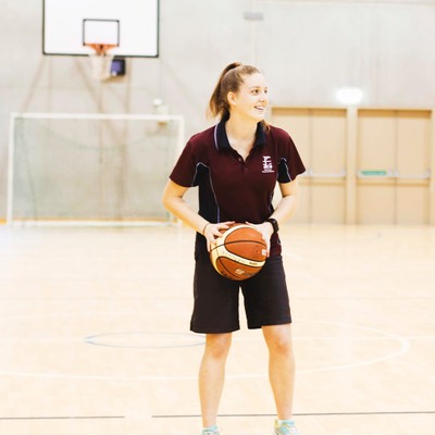 Medowie girl holding basketball prepared to pass the ball