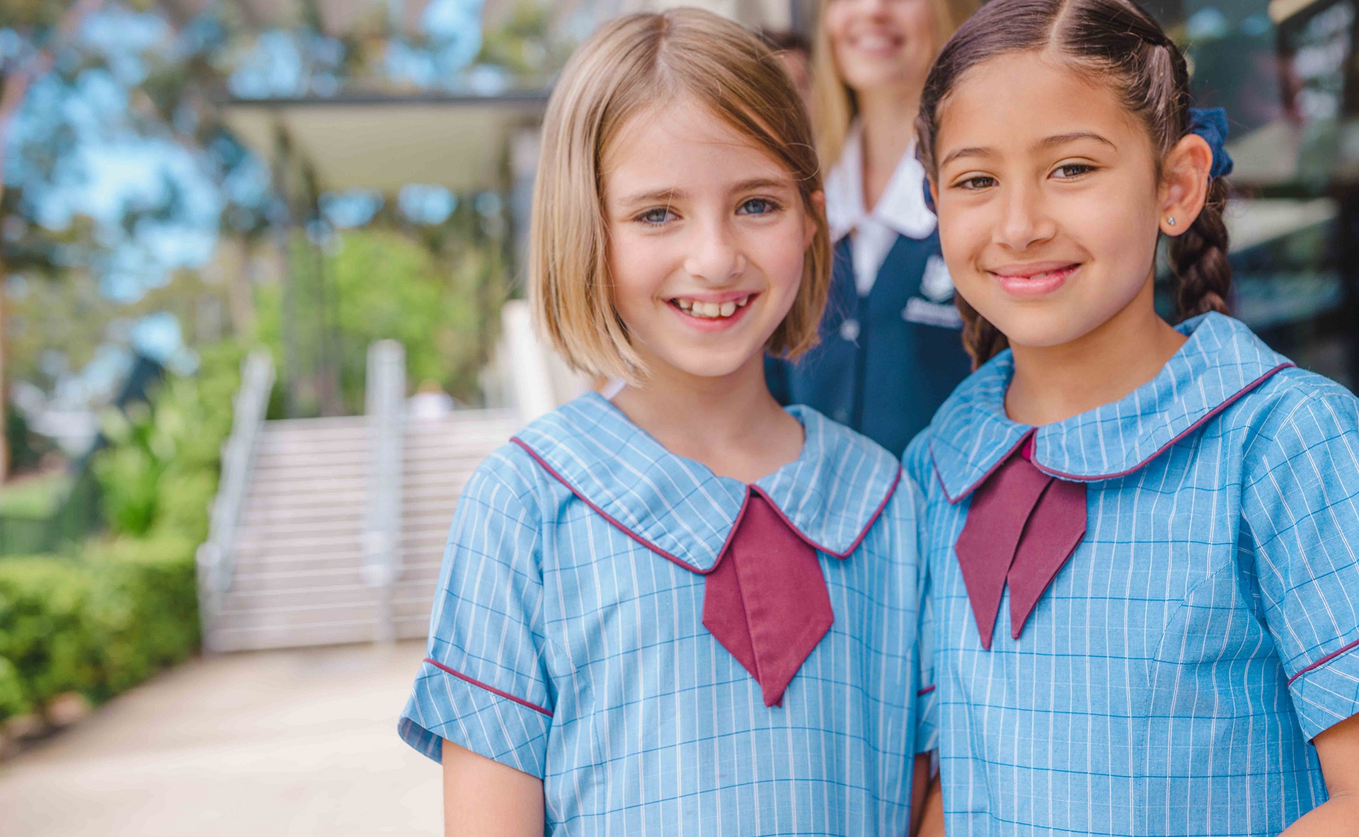 two smiling Christian Primary School girls who are friends