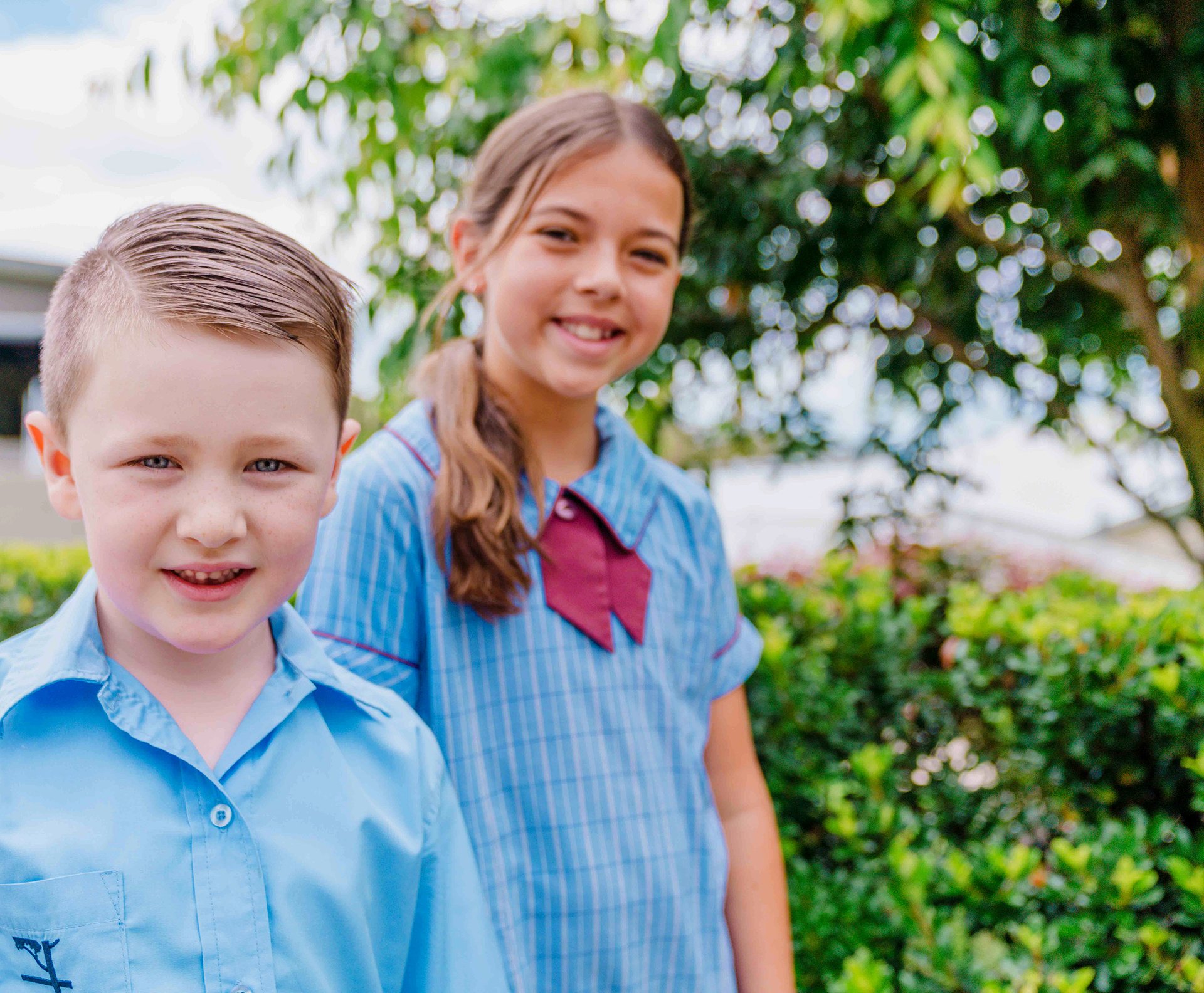 Girl and boy Medowie Christian School primary students in formal uniform